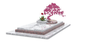 Pierre tombale avec plante et arbre décoratif.